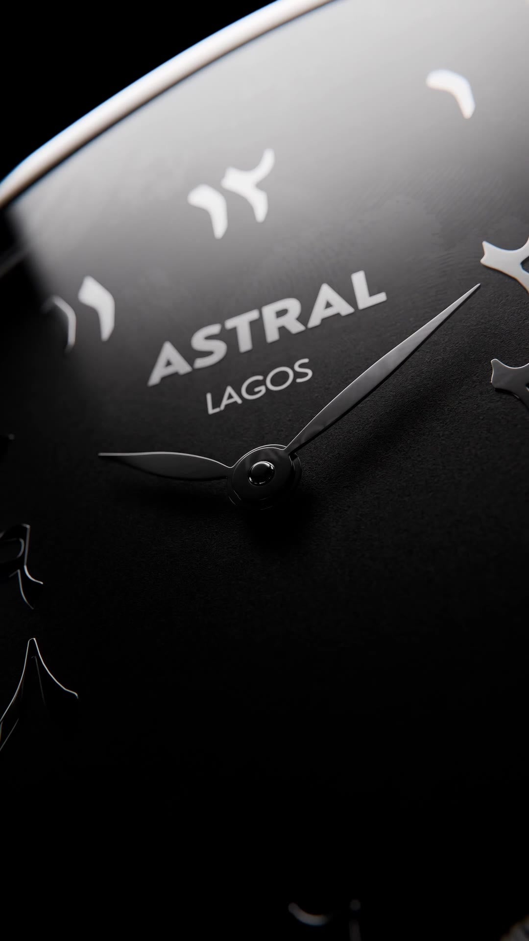 The ASTRAL and LAGOS wordmark on the black dial, in close-up