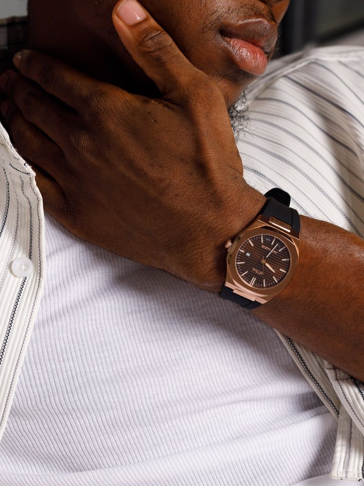 The same rose gold Astral Date Master on the silicone strap