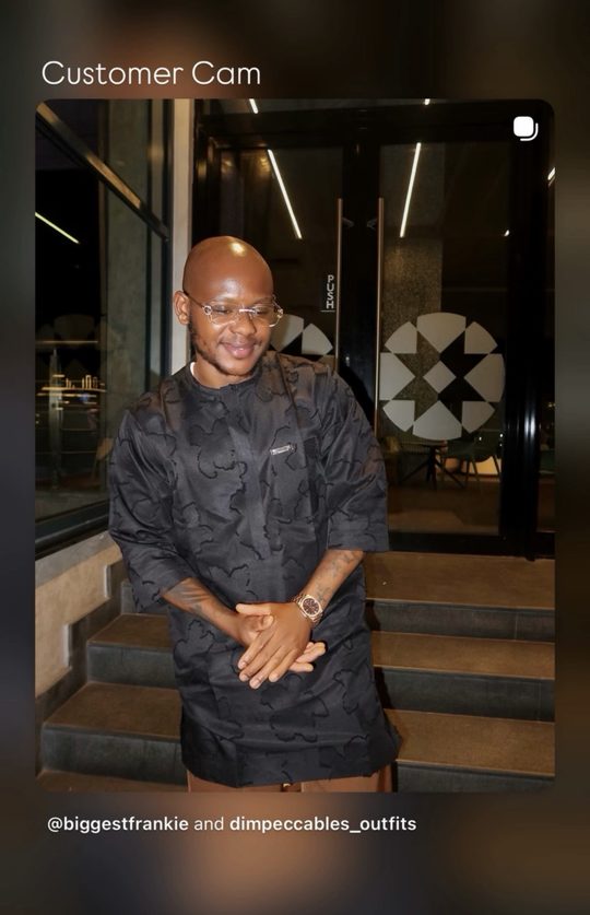 A customer in a black kaftan wearing a rose gold Astral Date Master
