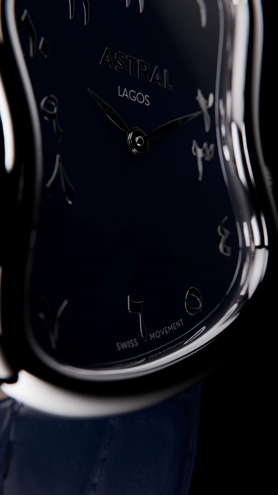 Close-up of the blue dial with raised Eastern Arabic numerals and Swiss Movement print